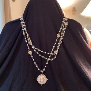 Virgins Saints & Angels silver necklace with pearlescent beads.